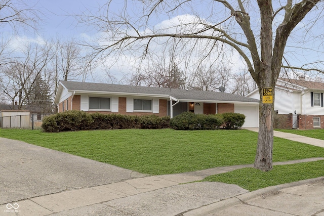 view of front of house with a garage and a front yard