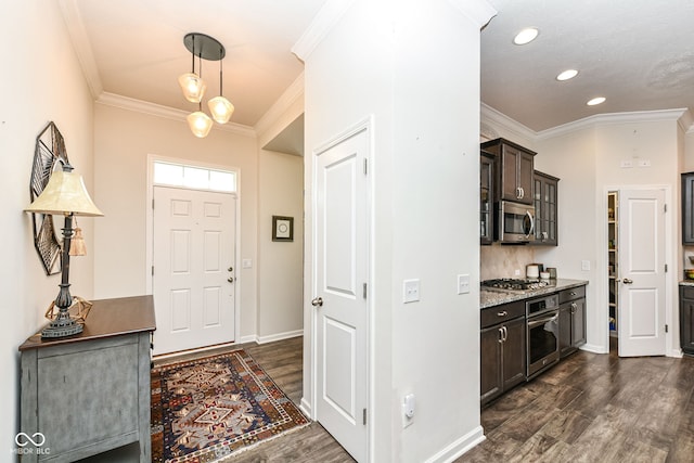 foyer with crown molding and dark wood-type flooring