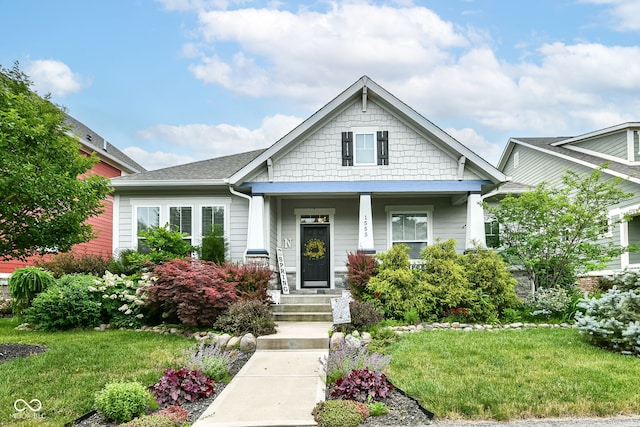 craftsman-style house with a front yard