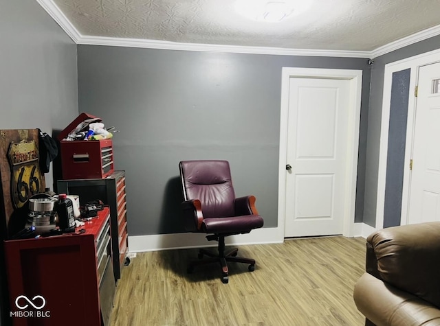 office area with crown molding, a textured ceiling, and light wood-type flooring