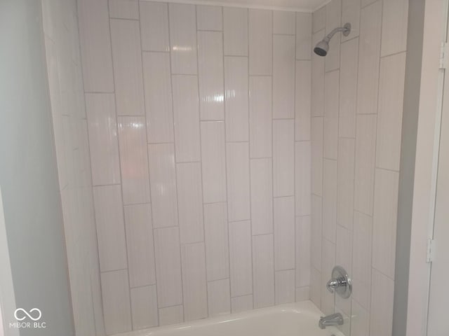 interior details with tiled shower / bath