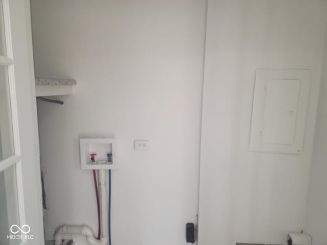 washroom with electric panel and hookup for a washing machine