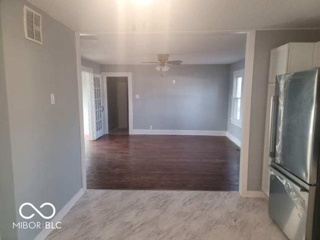 interior space with hardwood / wood-style flooring and ceiling fan