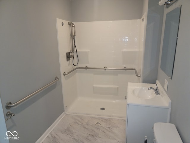 bathroom with vanity, toilet, and walk in shower