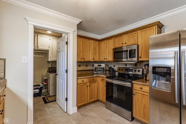 kitchen featuring crown molding, a textured ceiling, dark stone countertops, stainless steel appliances, and decorative backsplash