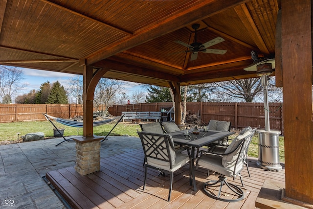 deck featuring a gazebo, ceiling fan, and a patio