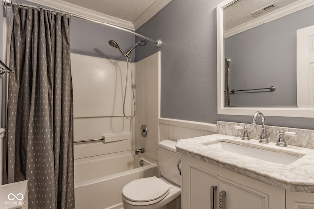 full bathroom featuring shower / bath combo, vanity, ornamental molding, a textured ceiling, and toilet