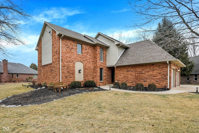 view of front property featuring a garage and a front yard