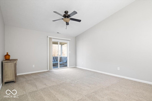 unfurnished room featuring lofted ceiling, light carpet, and ceiling fan