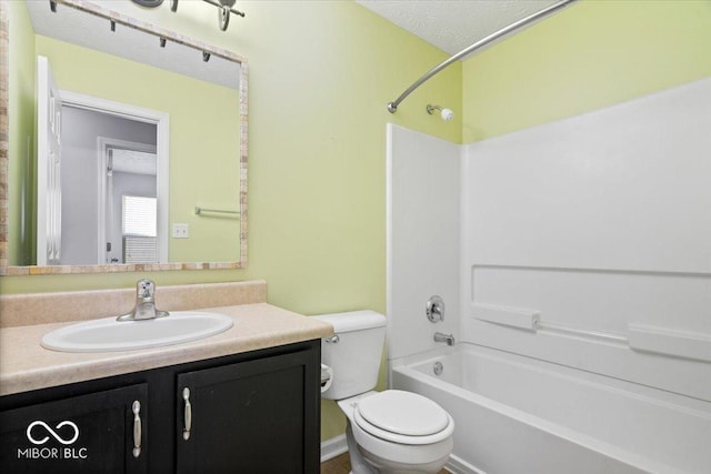 full bathroom with shower / tub combination, vanity, and toilet