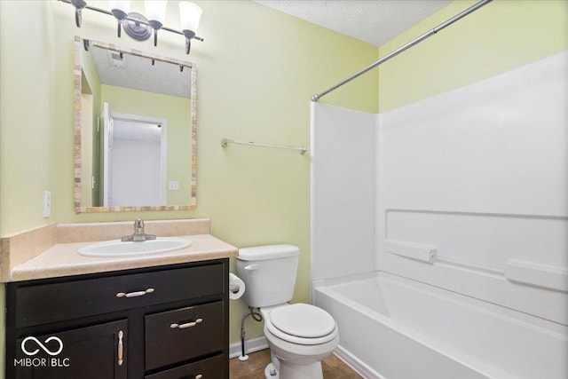 full bathroom with vanity, toilet, a textured ceiling, and shower / bath combination