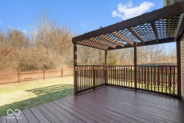 wooden terrace featuring a pergola and a lawn