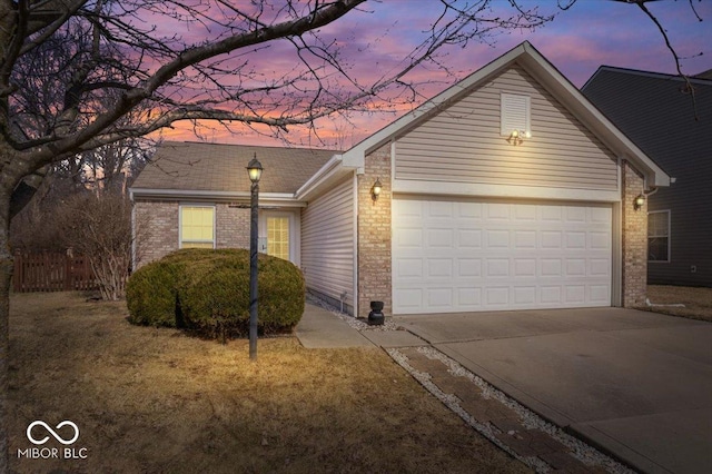 ranch-style house featuring a garage