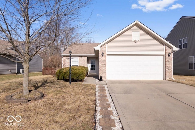 ranch-style home featuring a garage and a front lawn