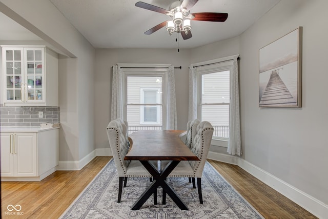 dining area featuring light hardwood / wood-style floors and ceiling fan