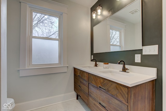 bathroom with vanity and toilet