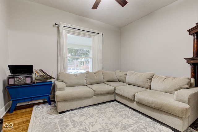 living room with hardwood / wood-style flooring and ceiling fan