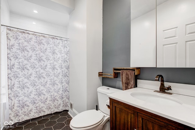 bathroom featuring vanity, tile patterned flooring, a shower with curtain, and toilet