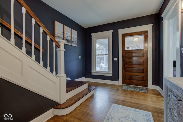 foyer with wood-type flooring