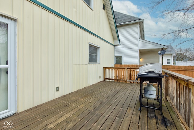 wooden deck featuring grilling area