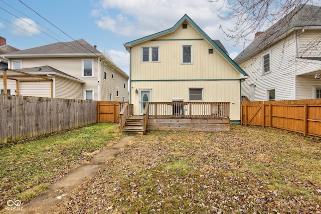 back of house with a wooden deck