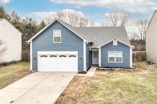 view of front of house with a garage, central AC, and a front yard