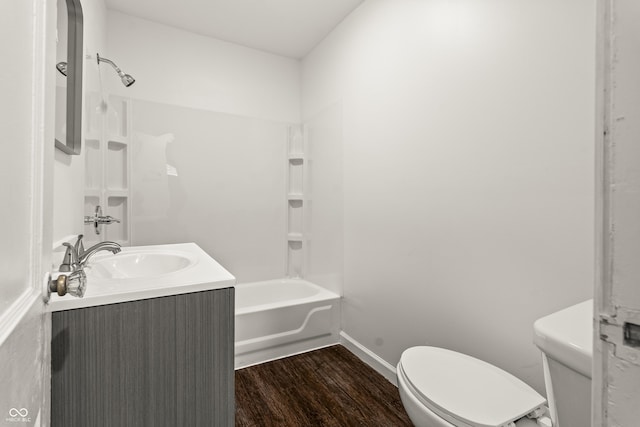 full bathroom featuring hardwood / wood-style flooring, vanity, toilet, and bathing tub / shower combination