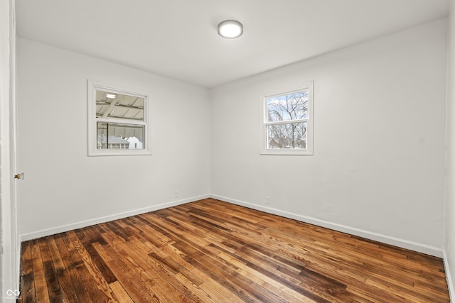 spare room featuring hardwood / wood-style floors