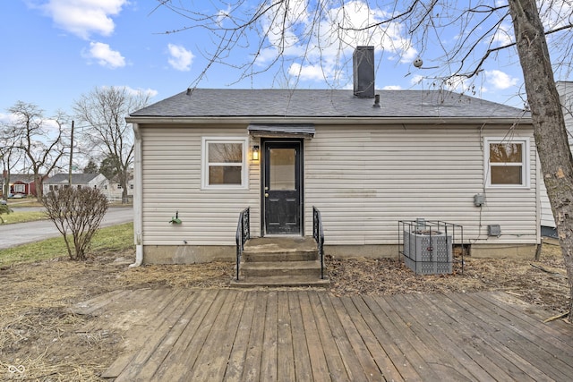 back of property featuring central air condition unit