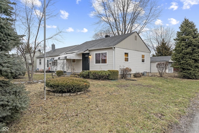 ranch-style home with a front lawn