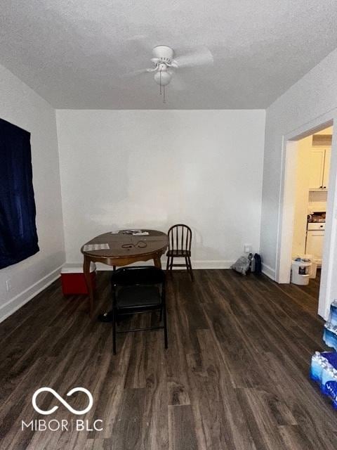 dining area featuring dark hardwood / wood-style flooring, ceiling fan, and a textured ceiling