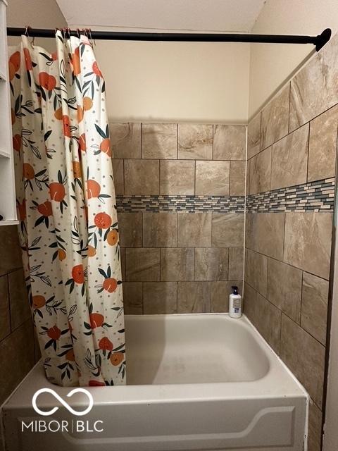 bathroom featuring shower / bath combination with curtain