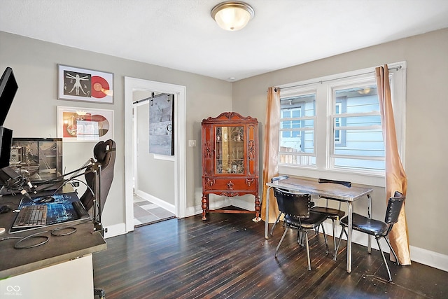 home office with dark hardwood / wood-style flooring