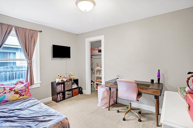 carpeted bedroom with a closet