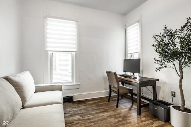 office space with dark hardwood / wood-style flooring