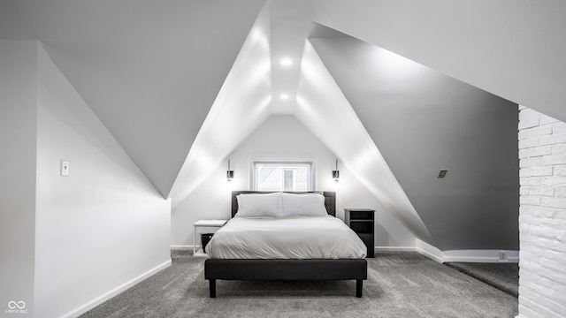 bedroom featuring vaulted ceiling and carpet