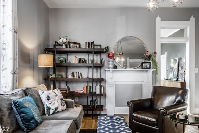 sitting room with wood-type flooring