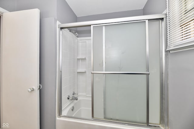 bathroom with enclosed tub / shower combo