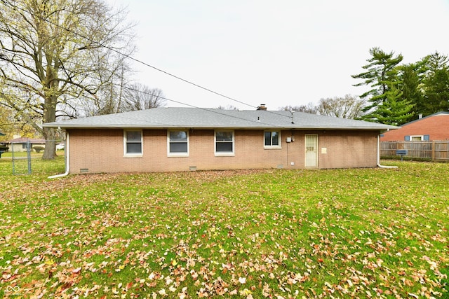 back of house with a yard