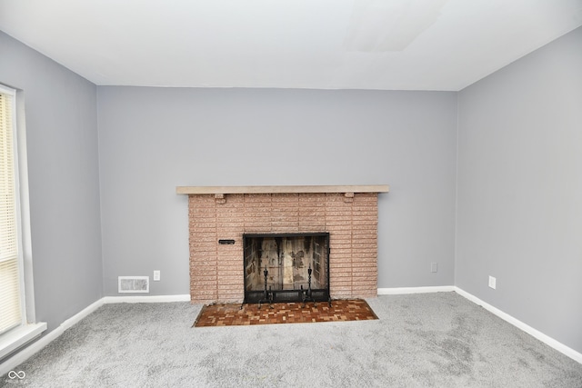 room details with carpet and a brick fireplace