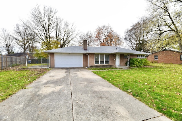 ranch-style house with a garage and a front yard