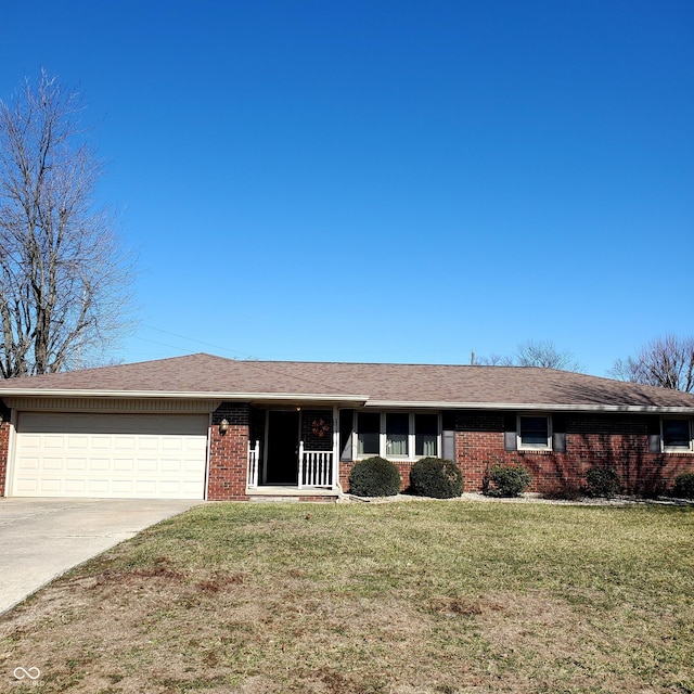 single story home featuring a garage, brick siding, a shingled roof, concrete driveway, and a front yard