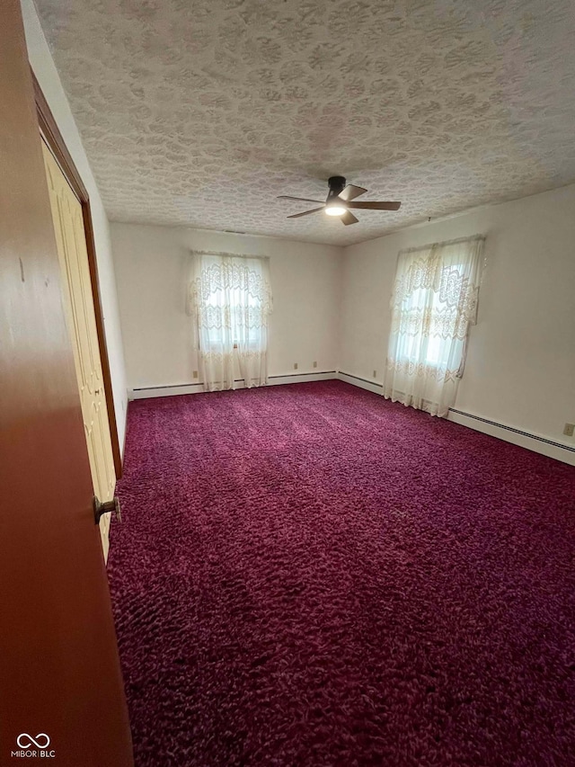 unfurnished room featuring ceiling fan, carpet flooring, and a textured ceiling