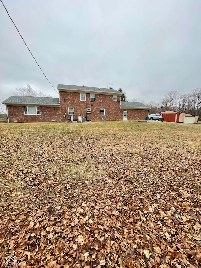 view of side of property featuring a yard