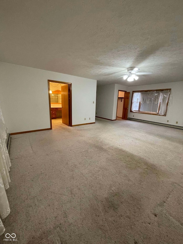 unfurnished living room with ceiling fan, a baseboard radiator, carpet, and a textured ceiling