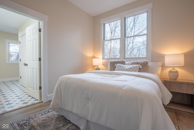 bedroom with hardwood / wood-style floors