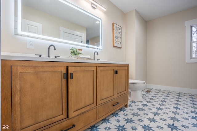 bathroom with vanity and toilet