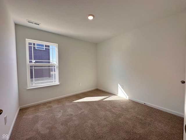 empty room featuring carpet floors