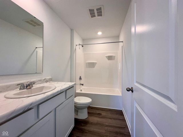 full bathroom featuring vanity, toilet, bathing tub / shower combination, and hardwood / wood-style floors