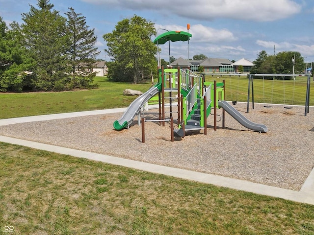 view of jungle gym featuring a lawn